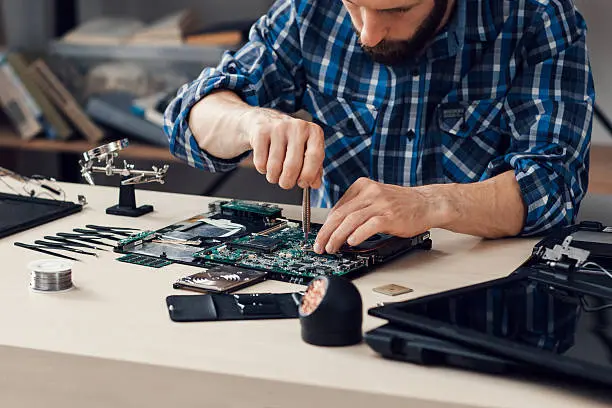 Repair Genius on-site technician repairing a laptop