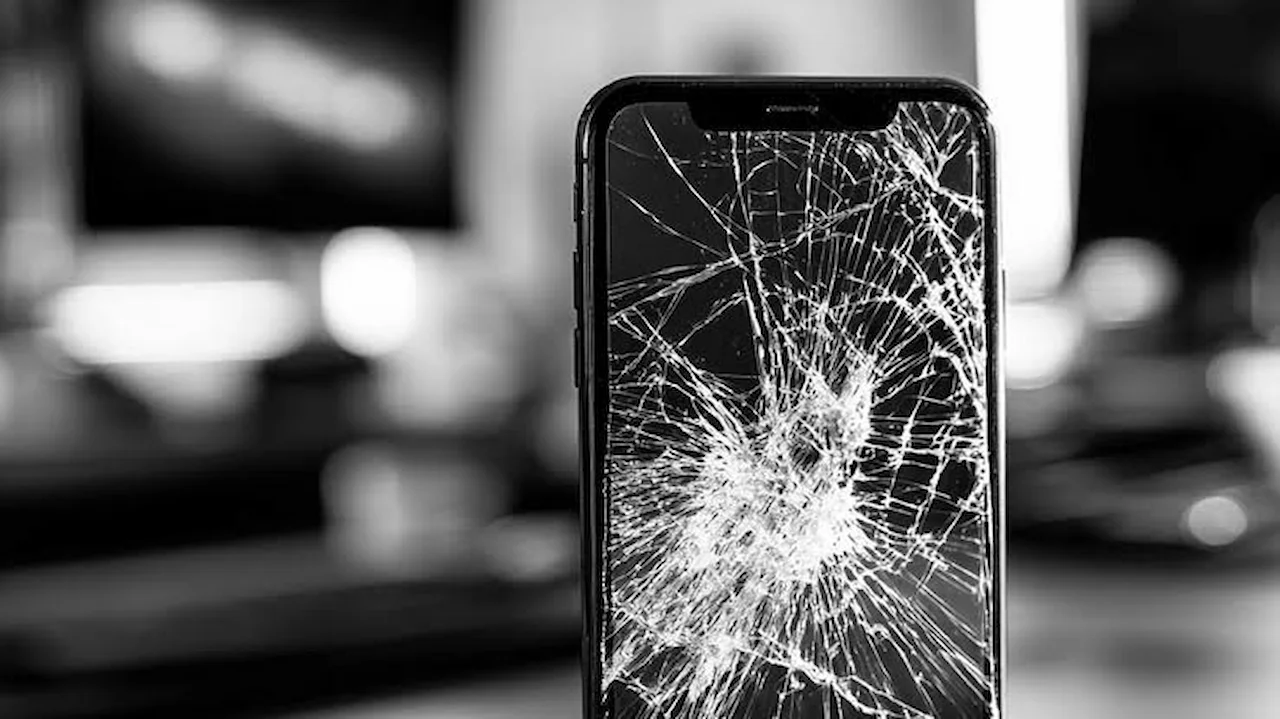 Cracked iPhone screen showing severe damage that indicates the display may need replacement