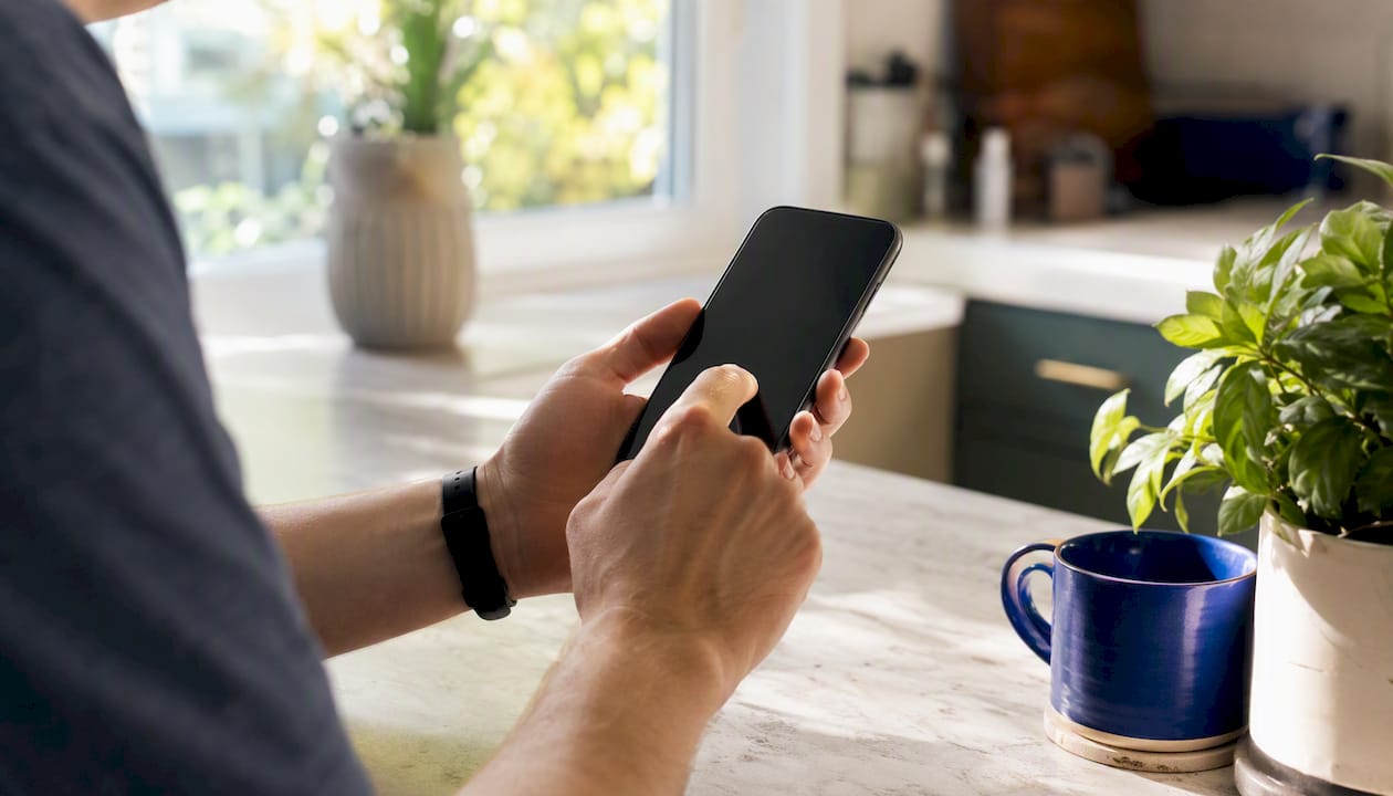 Hands initiating phone contacts backup