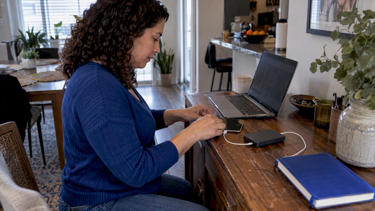Person preparing encrypted backup before device repair
