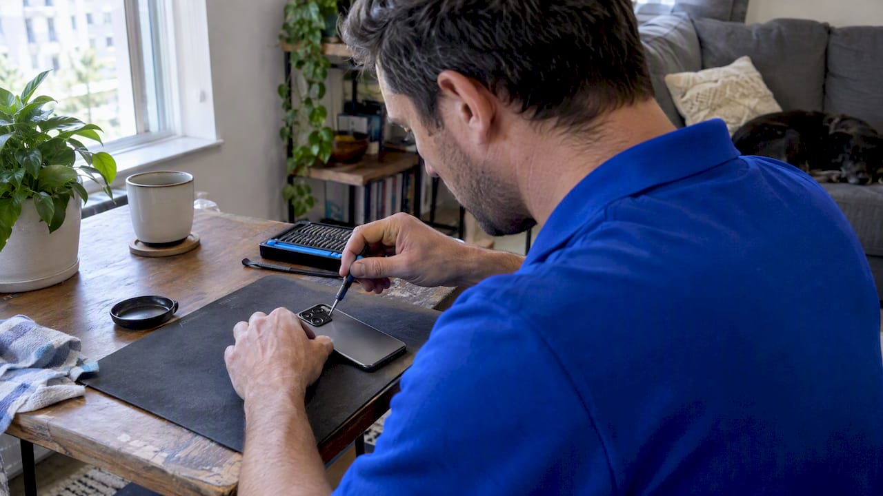 Technician inspecting an Android phone camera
